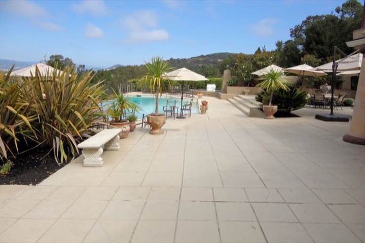 Landscaped outdoor living of a luxury home (stand-in image)